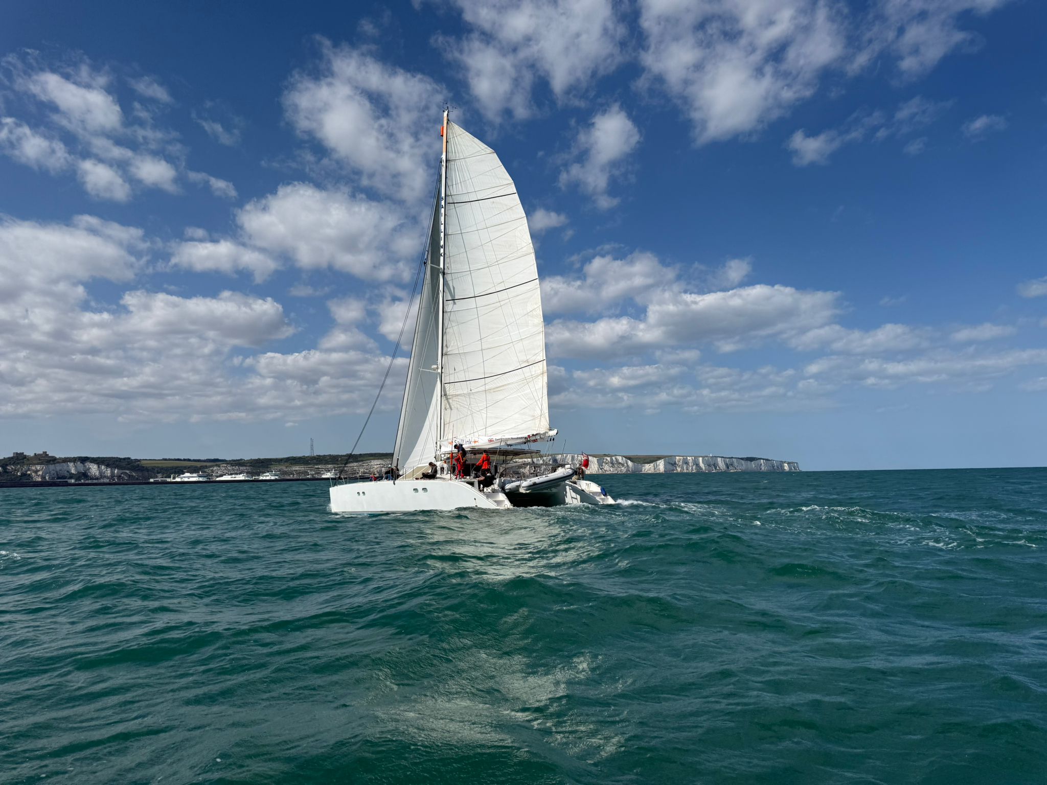 The SailLink catamaran Echoes crossing the Channel under sail between Dover and Boulogne-sur-Mer