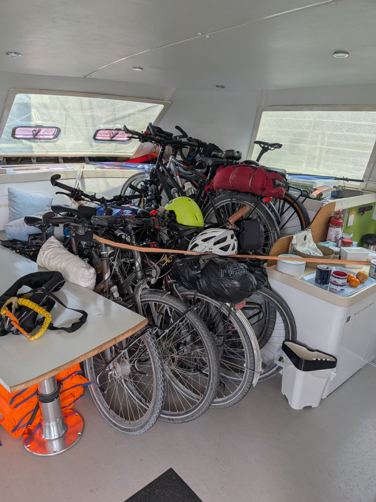 Bikes stored and strapped safely inside the cockpit of the SailLink catamaran for the Channel crossing